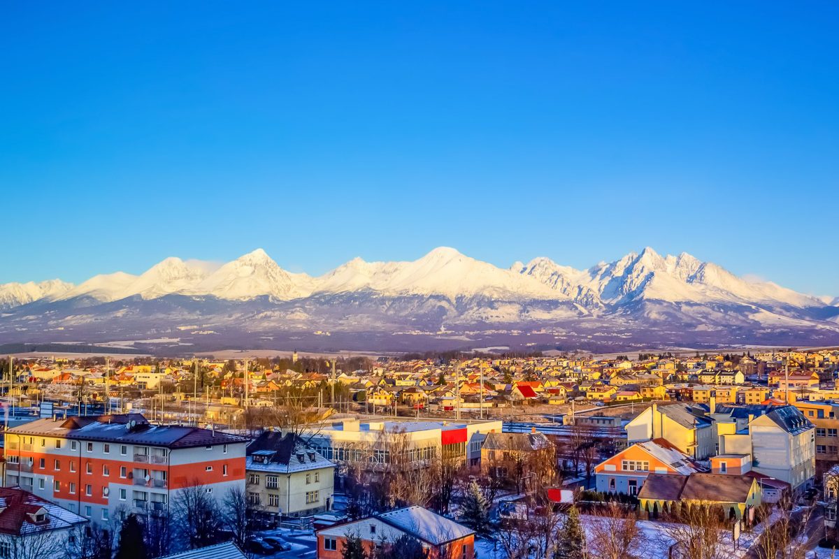 Mountains over colorful buildings and houses at Poprad, Slovakia. Morning